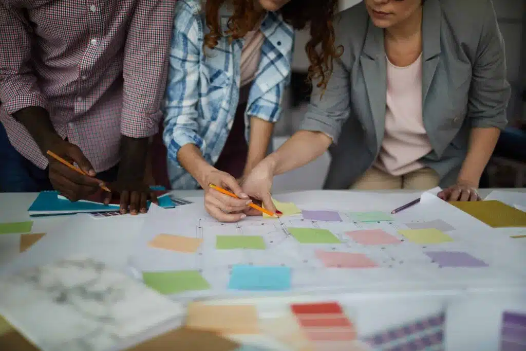 a group of people looking at a piece of paper